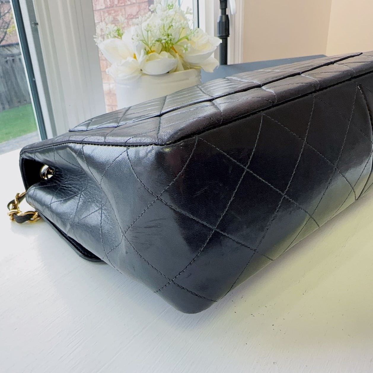 Chanel-Timeless-Jumbo-single-shoulder-flap-bag-black-quilted-lambskin-Cornes