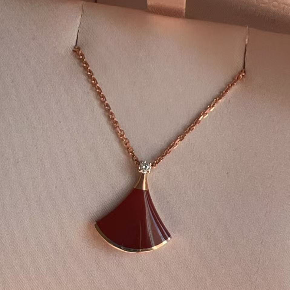 Necklace with a red pendant on a mannequin bust