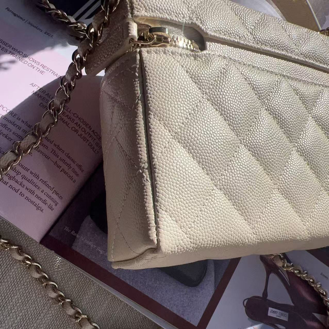 Beige handbag with gold chain strap