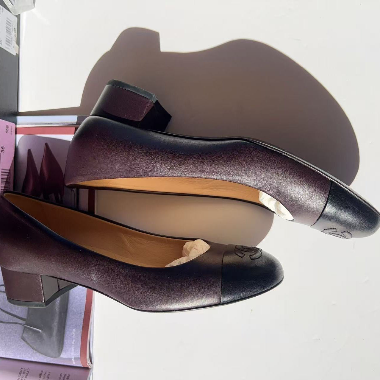 Pair of high-heeled shoes on a white background