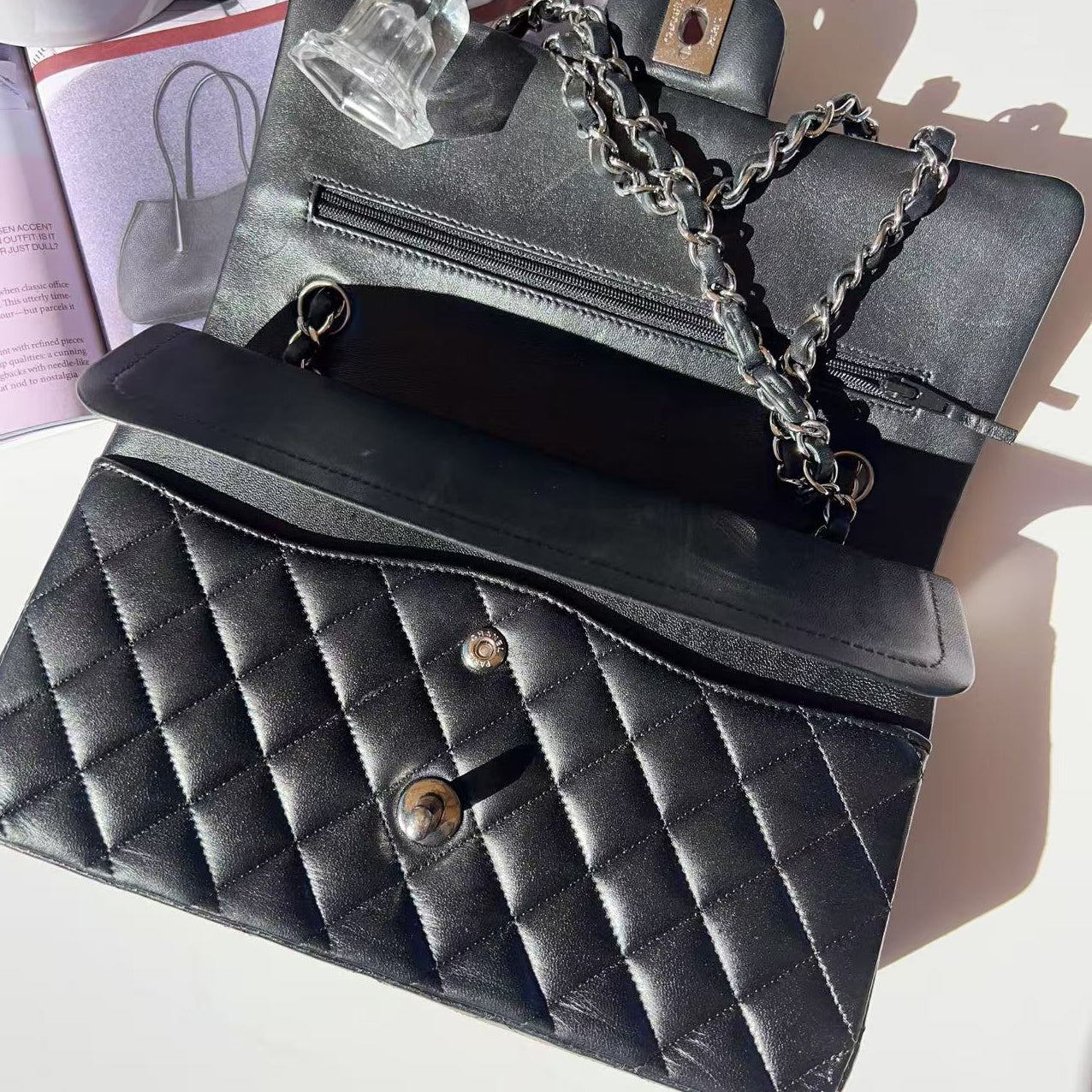 Black quilted handbag with chain detail