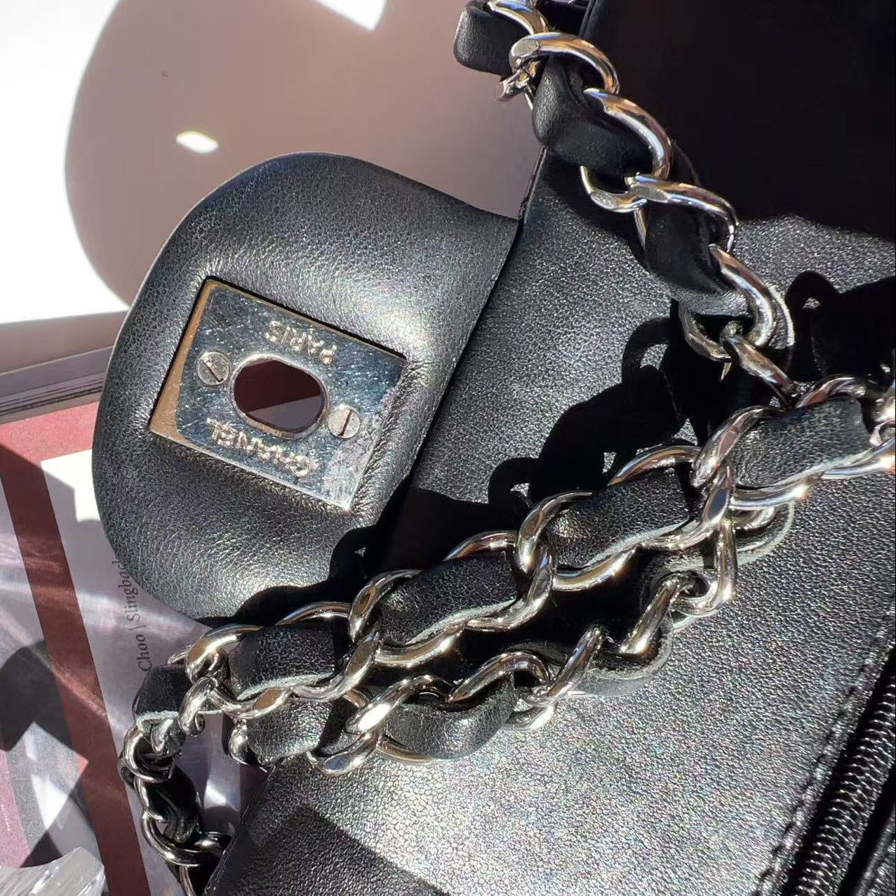 Black handbag with chain detail