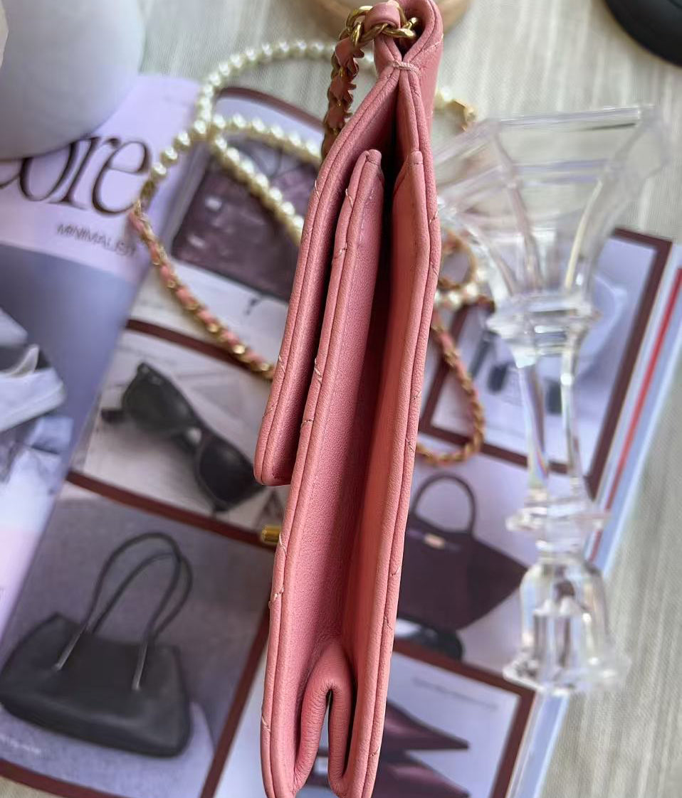 Chanel Pink handbag on a magazine