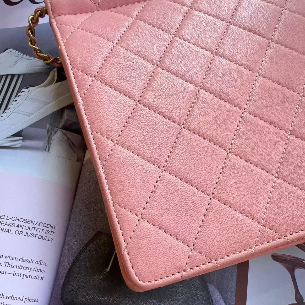 Chanel Pink quilted handbag on a stand