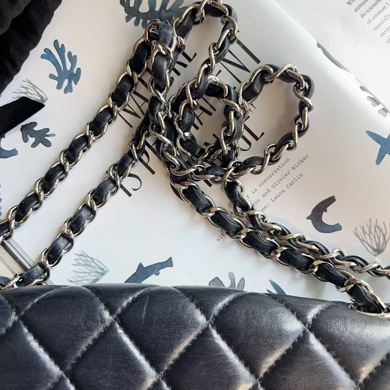 Black quilted handbag with chain strap