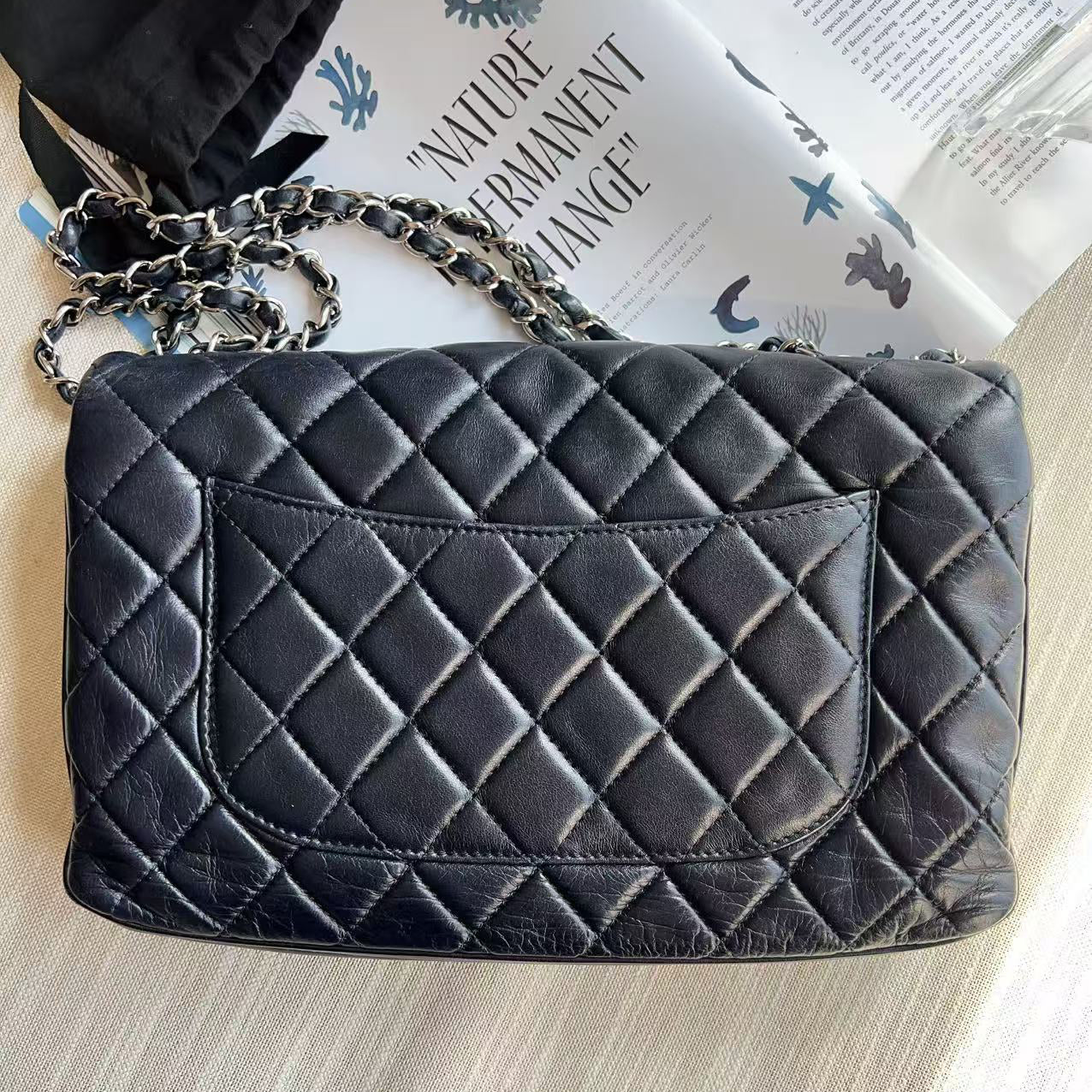 Quilted black handbag with a chain strap