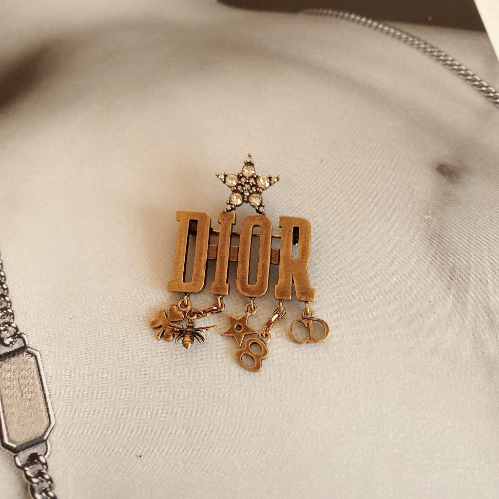 DIOR Metal Crystal evolution Logo Brooch Antique Gold