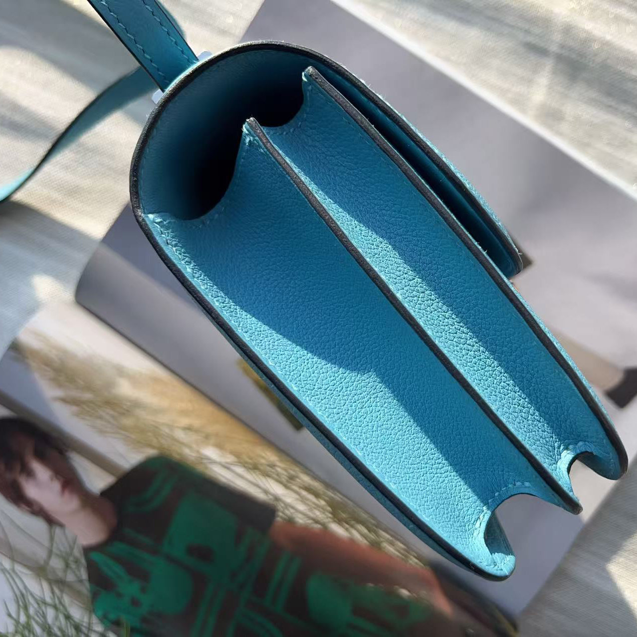 Blue metal tool on a white surface