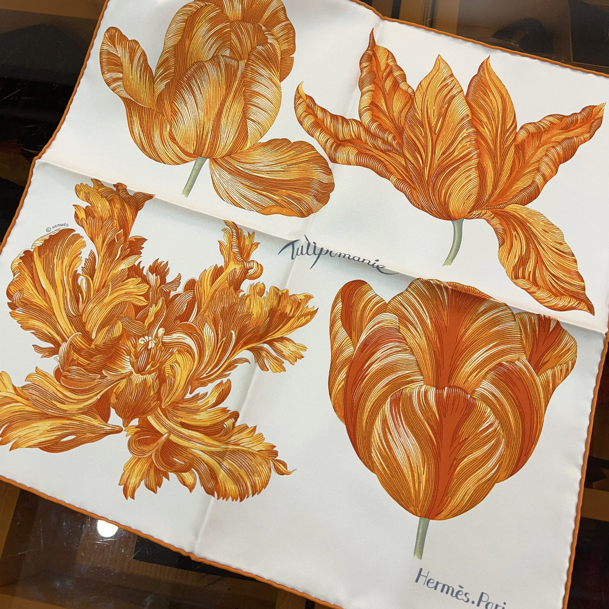 Floral design on a white background with an orange box in the background