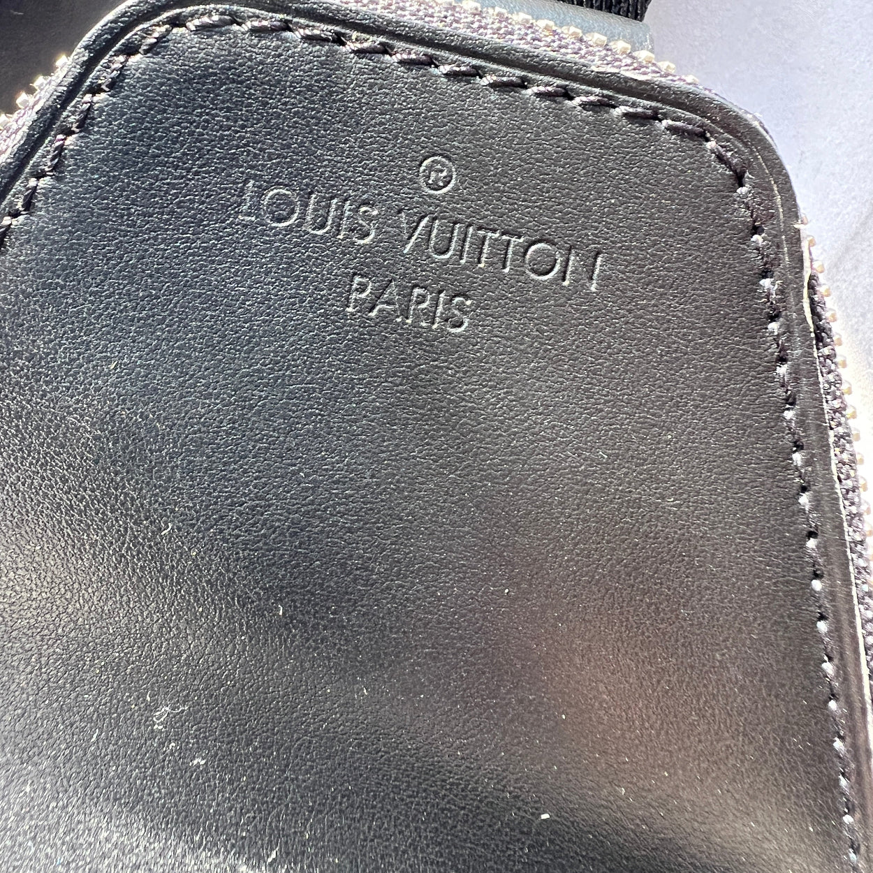 Close-up of a Louis Vuitton bag with visible branding.