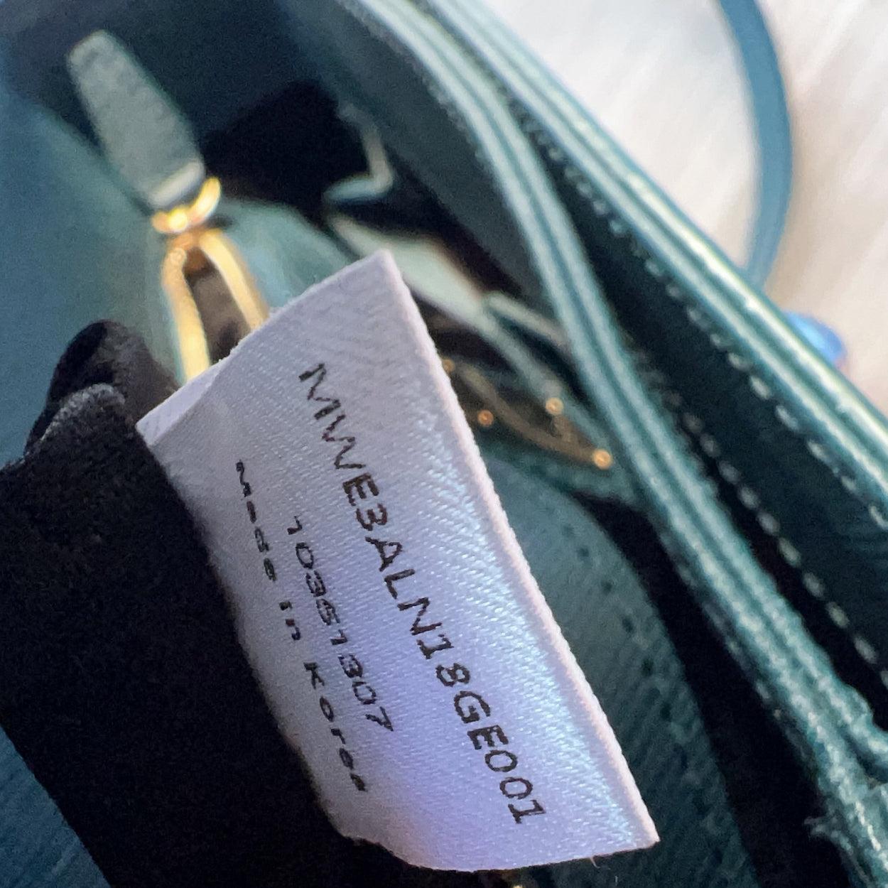 Close-up of a label on a product with text and a code.