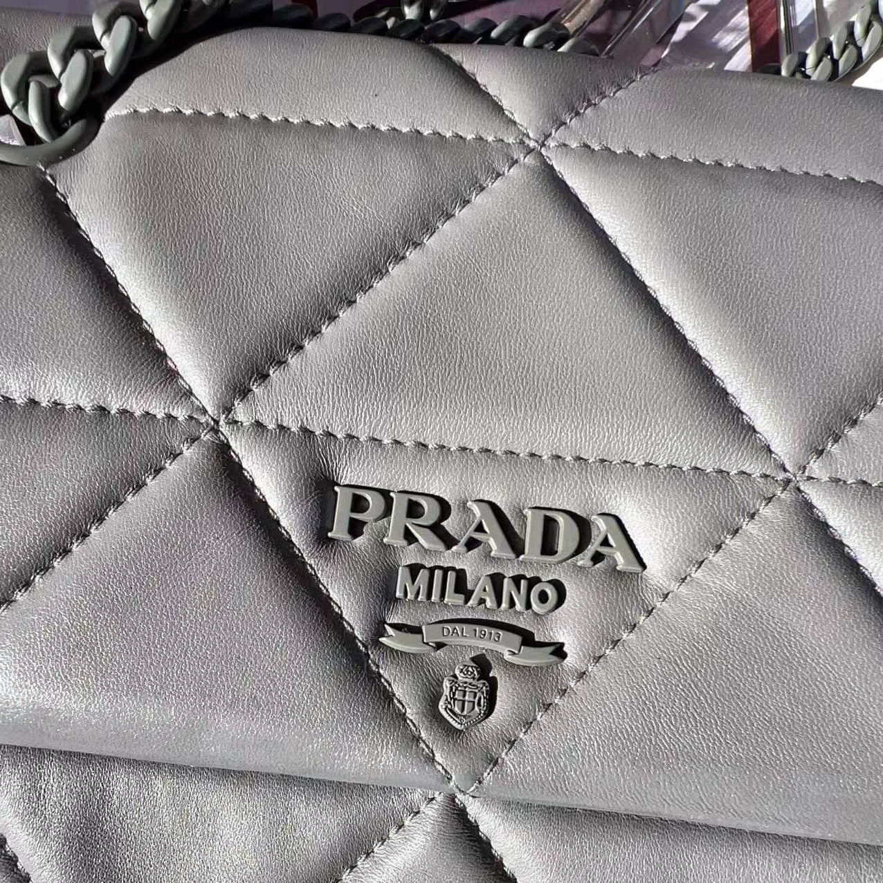 Quilted gray handbag with Prada logo