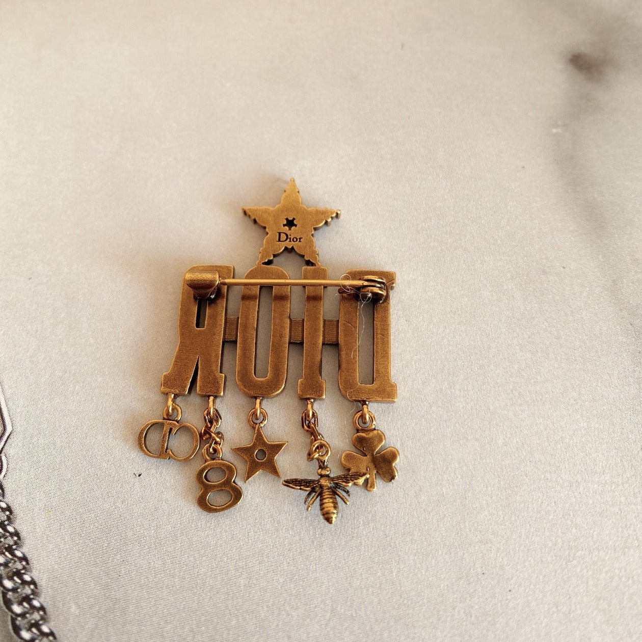DIOR Metal Crystal Evolution Logo Brooch Antique Gold