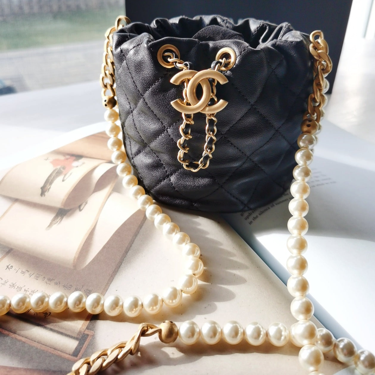 Chanel Calfskin Quilted Pearl Mini About Pearls Drawstring Bucket Bag Black