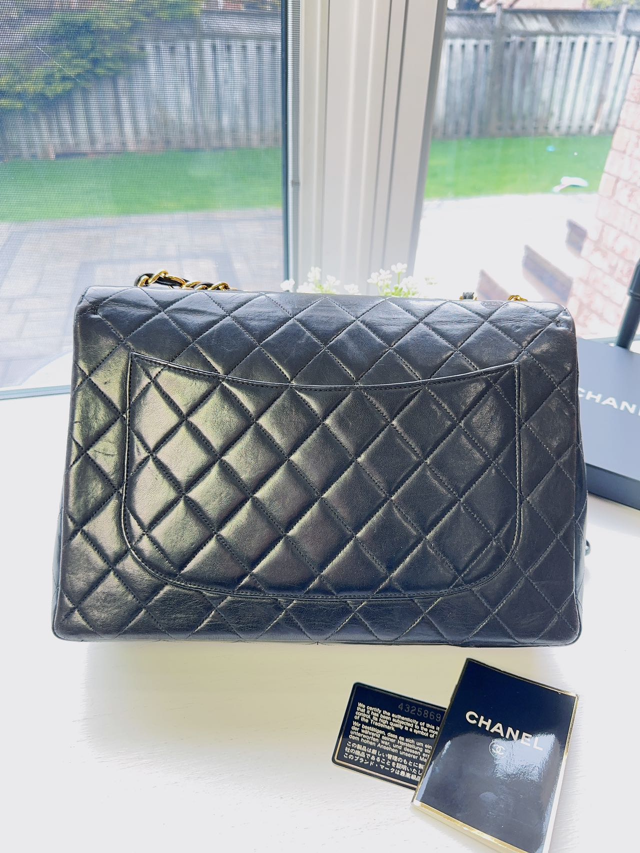 Chanel Timeless Jumbo single shoulder flap bag in black quilted lambskin