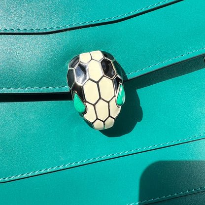 Close-up of a soccer ball design on a teal leather surface