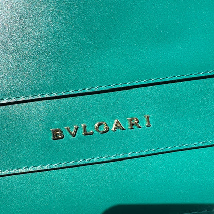 Teal leather product with 'Bulgari' branding on a white background
