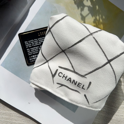 Chanel handkerchief on a magazine with a blurred background