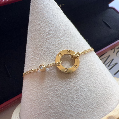 Gold bracelet on a cone-shaped jewelry display