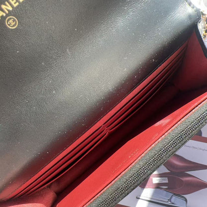 Close-up of a black and red Chanel wallet 