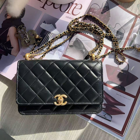 Chanel Black quilted handbag with gold chain 
