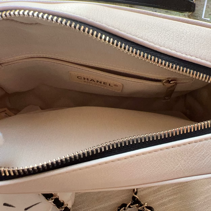Beige Chanel handbag with visible brand logo