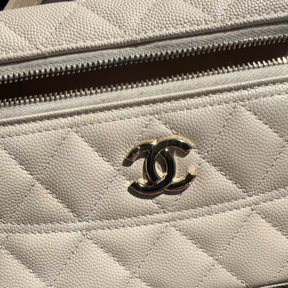 Close-up of a beige quilted handbag with Chanel logo
