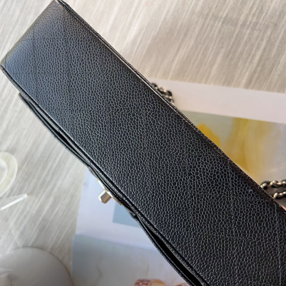 Black leather wallet on a textured surface with a blurred background