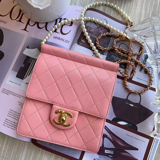 Chanel Pink quilted handbag with gold clasp 