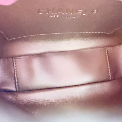 Close-up of a Chanel handbag interior with visible branding.