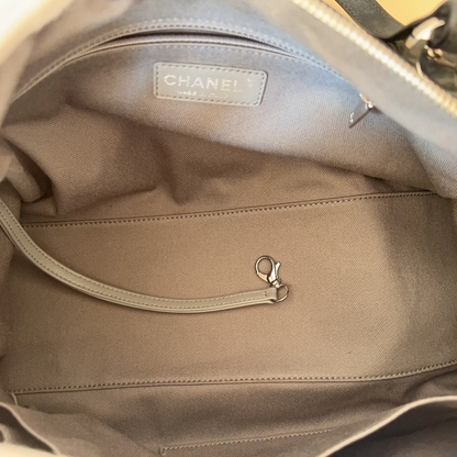 Close-up of a Chanel handbag interior with visible branding.