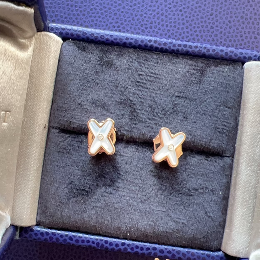 Star-shaped earrings in a Chopard Paris jewelry box