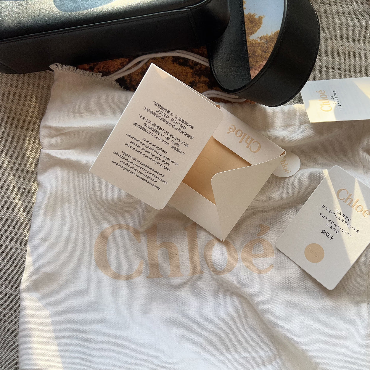 Chloe product packaging with cards on a branded cloth