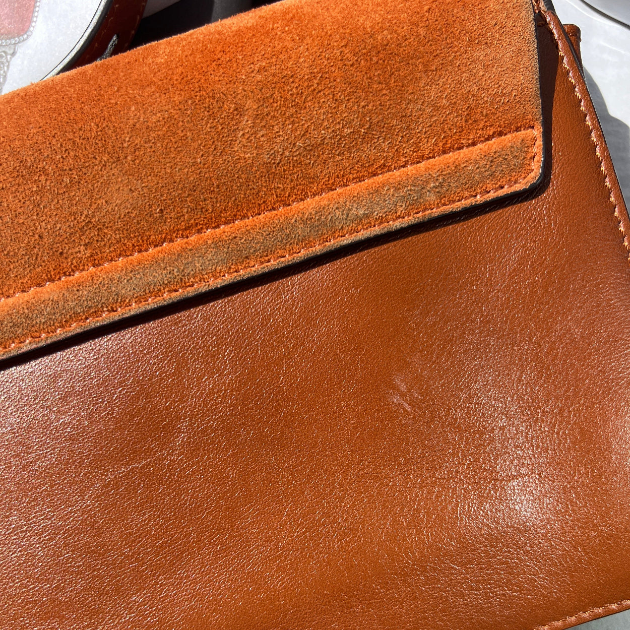 Close-up of a brown leather wallet with visible texture