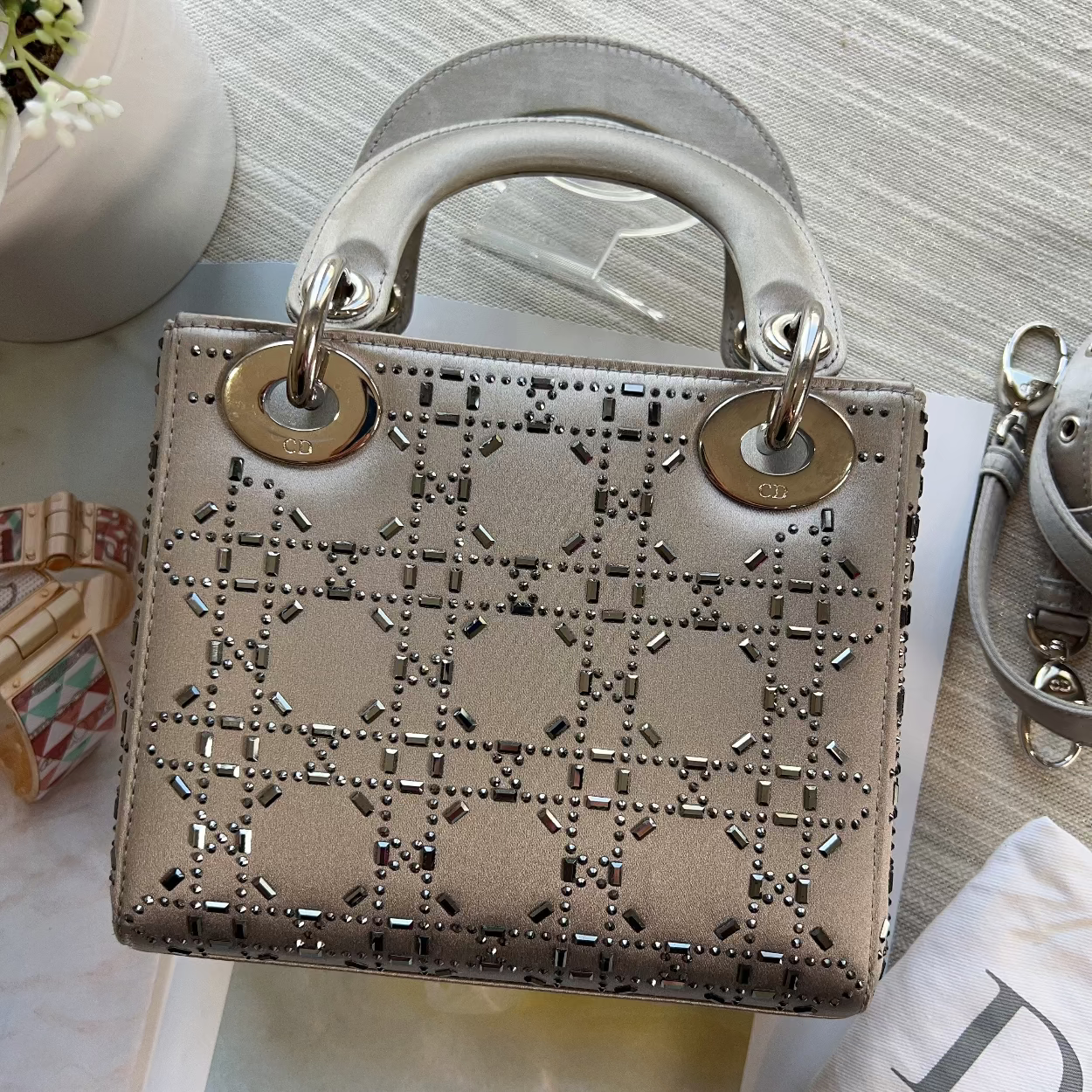 Designer handbag with distinctive pattern on a light surface
