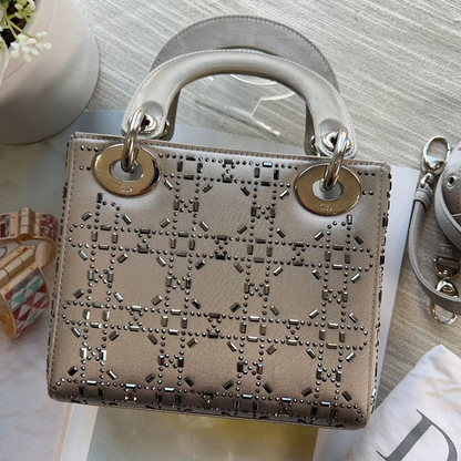 Designer handbag with distinctive pattern on a light surface