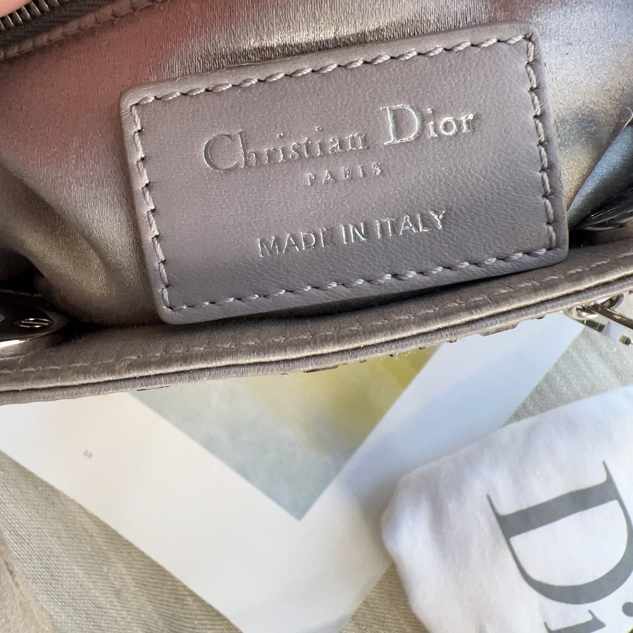Close-up of a Christian Dior bag with a visible brand label.