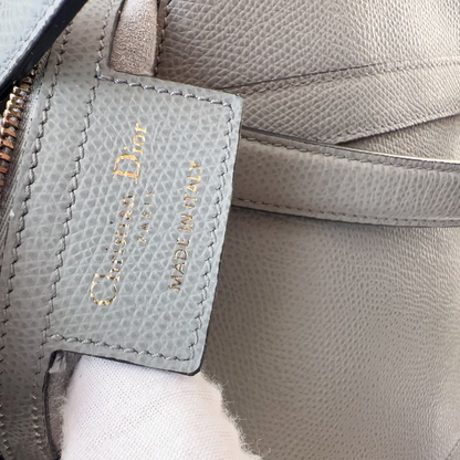 Close-up of a Dior handbag with a visible brand label.