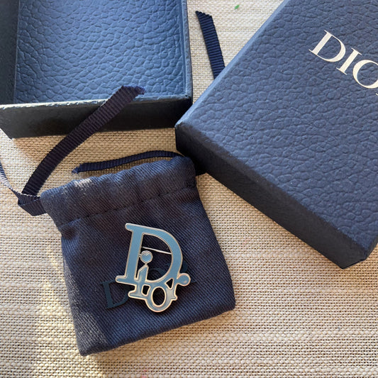 Dior jewelry pouch with logo on a textured surface