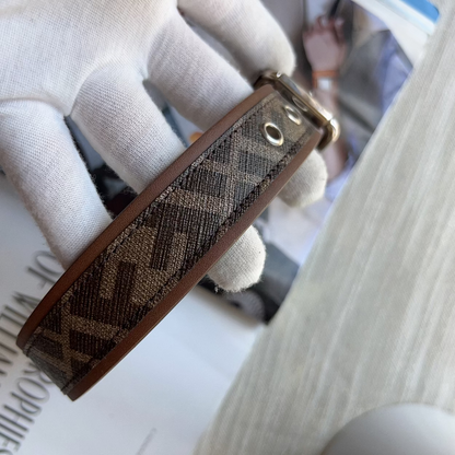 Brown patterned keychain on a newspaper with a blurred background