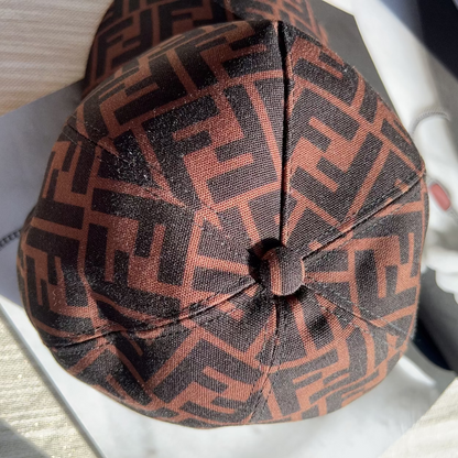 Brown patterned cap on a white surface