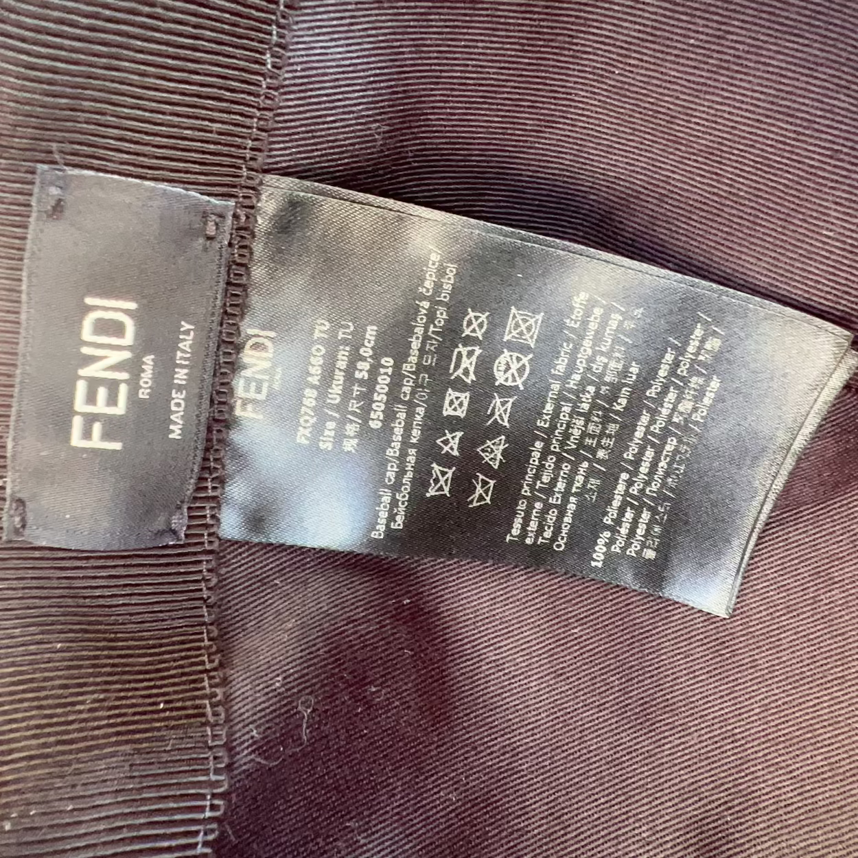 Fendi label on a brown fabric background