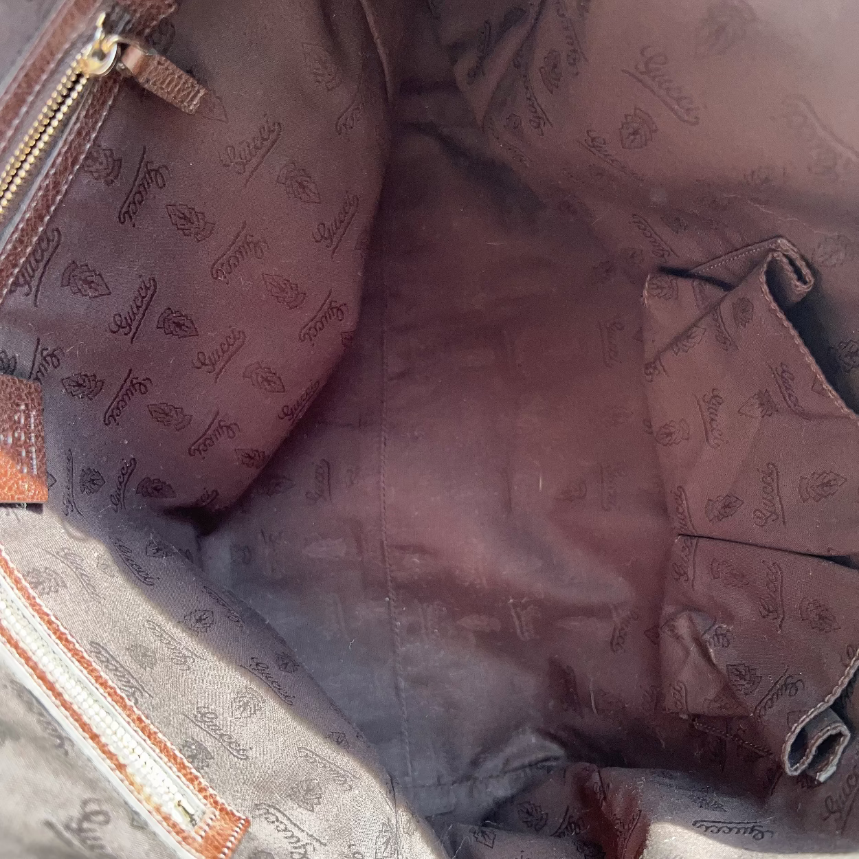 Close-up of a brown textured bag with a zipper