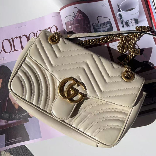 Beige handbag with gold chain