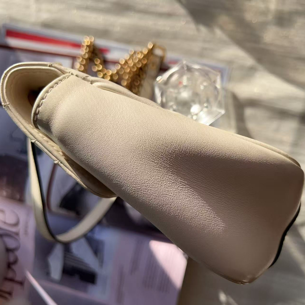 Beige sandal on a surface 