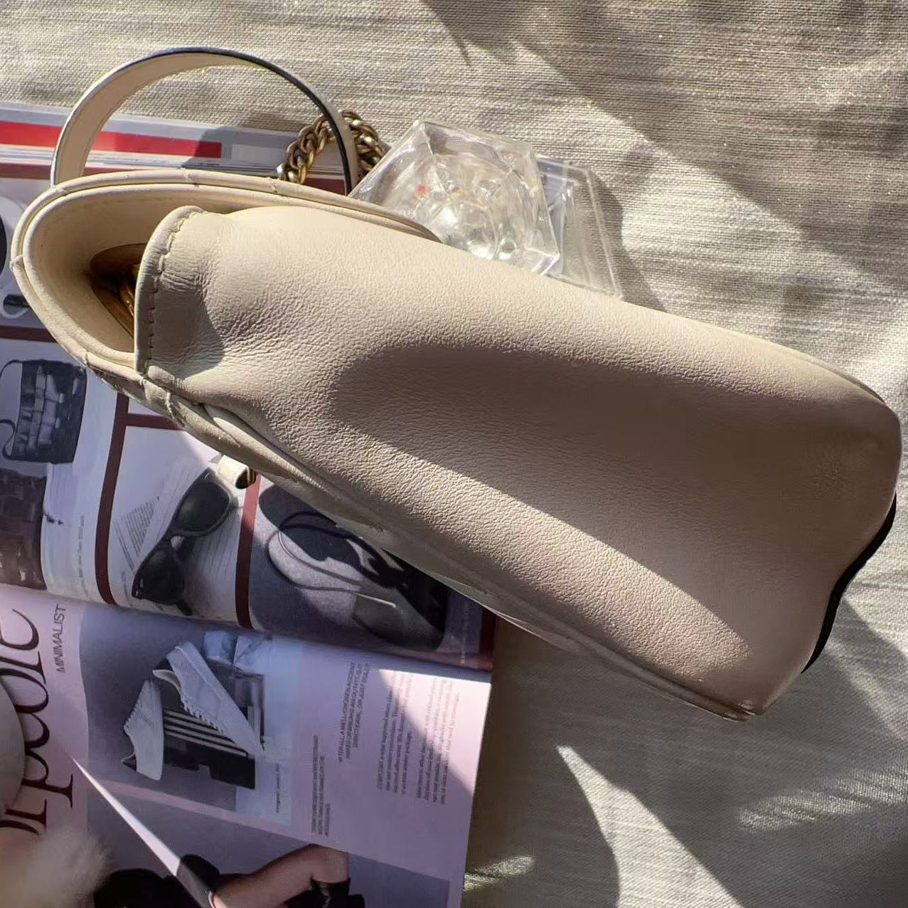 Beige loafer on a magazine 