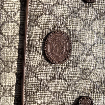 Close-up of a textured surface with a pattern and a central emblem.