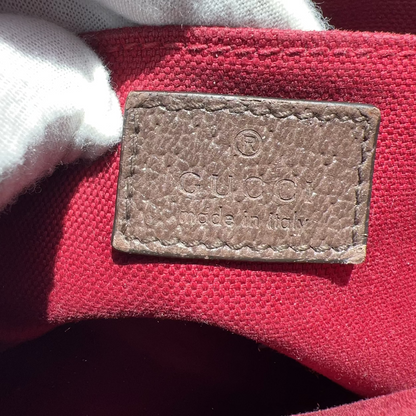 Gucci label on a red fabric background