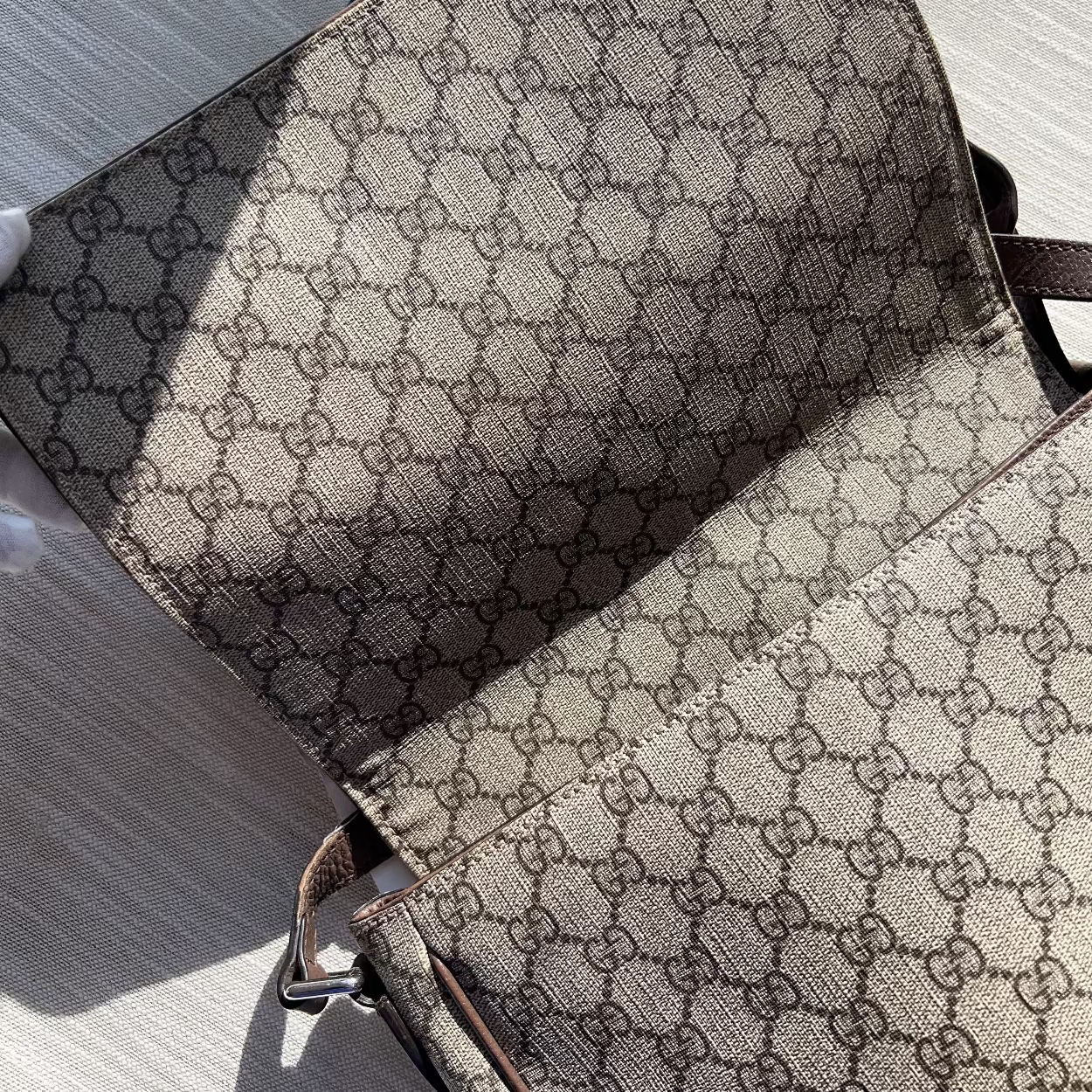 Two patterned bags on a textured surface