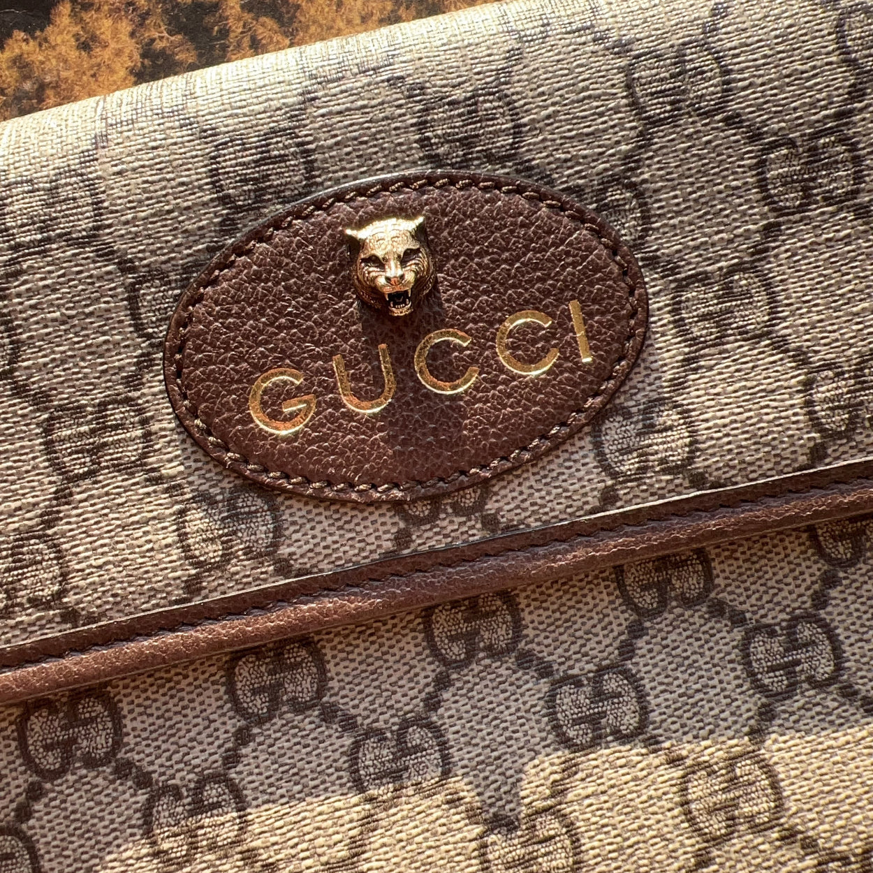 Gucci wallet with logo on a textured surface